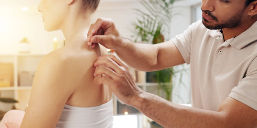 Acupuncture treatment on a customer’s back in a holistic spa, offering healing and stress relief.